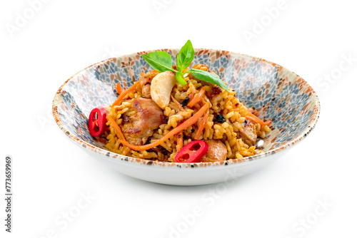 Pilaf with chicken, a dish of stewed meat with rice, carrots, onions and garlic. Oriental cuisine with spices and rice.