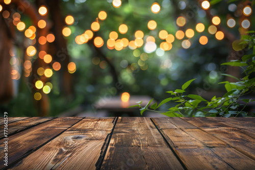The warm wooden texture of a table is the focus, with a beautifully blurred backdrop of festive bokeh lights creating an inviting ambiance