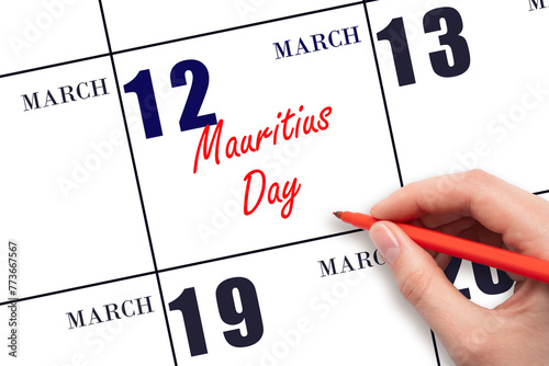 March 12. Hand writing text Mauritius Day on calendar date. Save the date.