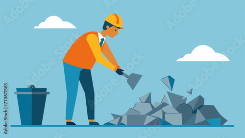 A worker carefully sorts through a large pile of s metal pieces separating out those that can be melted down and reused in the production