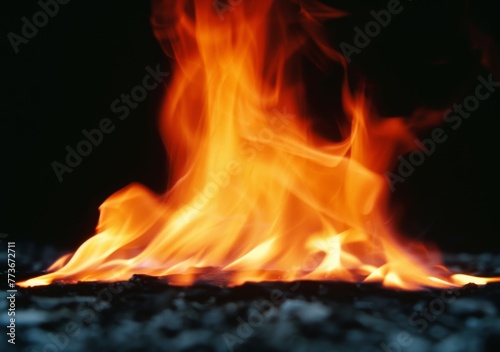 A fire is burning in the background of a black and white photo