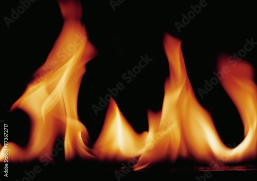 A close up of a fire with its flames reaching up to the top of the frame