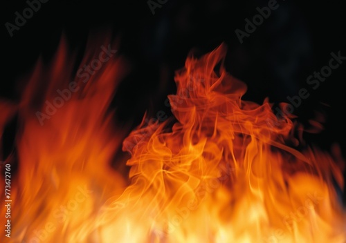 A fire is burning in the background of a black and white photo