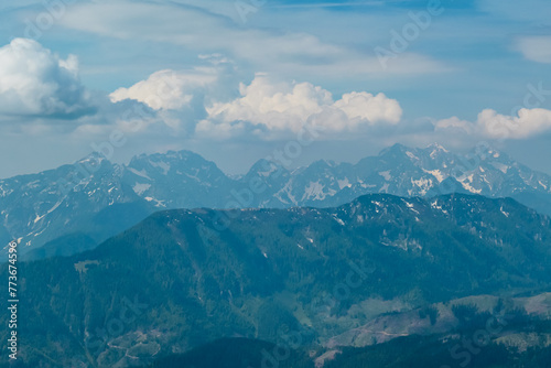 Panoramic view of majestic mountain peaks of Julian Alps seen from on top of Feistritzer Spitze (Hochpetzen), Karawanks, Carinthia, border Austria Slovenia. Looking at unique rock formation Grintovec