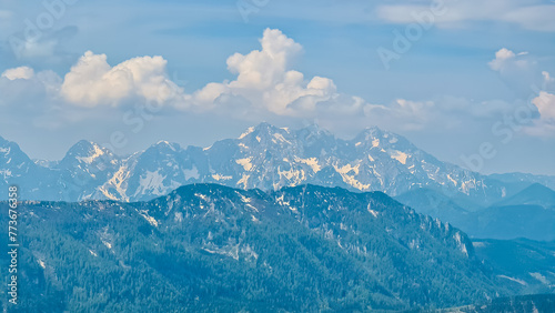 Panoramic view of majestic mountain peaks of Julian Alps seen from on top of Feistritzer Spitze (Hochpetzen), Karawanks, Carinthia, border Austria Slovenia. Looking at unique rock formation Grintovec photo