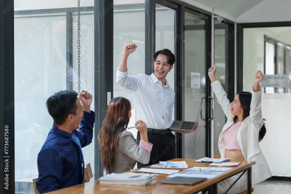 Great job! Successful business team is clapping their hands in modern workstation, celebrating the performance of new product Great job! Successful business team is clapping their hands in modern workstation, celebrating the performance of new product