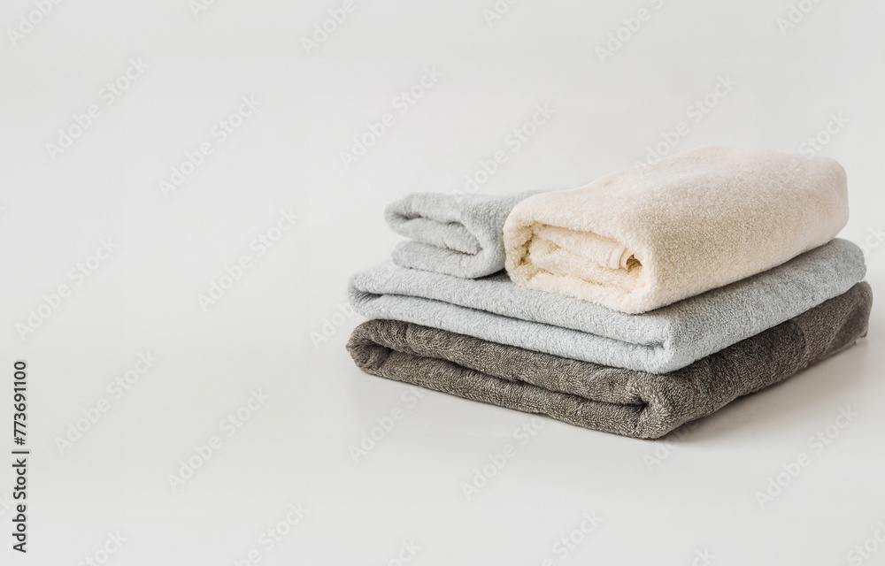 An Immaculate Display of Neatly Stacked White Towels on a Background, Isolated from Surrounding An Immaculate Display of Neatly Stacked White Towels on a Background, Isolated from Surrounding