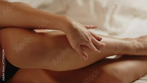 Wallpaper Mural Close up of hand caressing the leg and thigh of a beautiful woman laying in bed wearing lingerie Torontodigital.ca