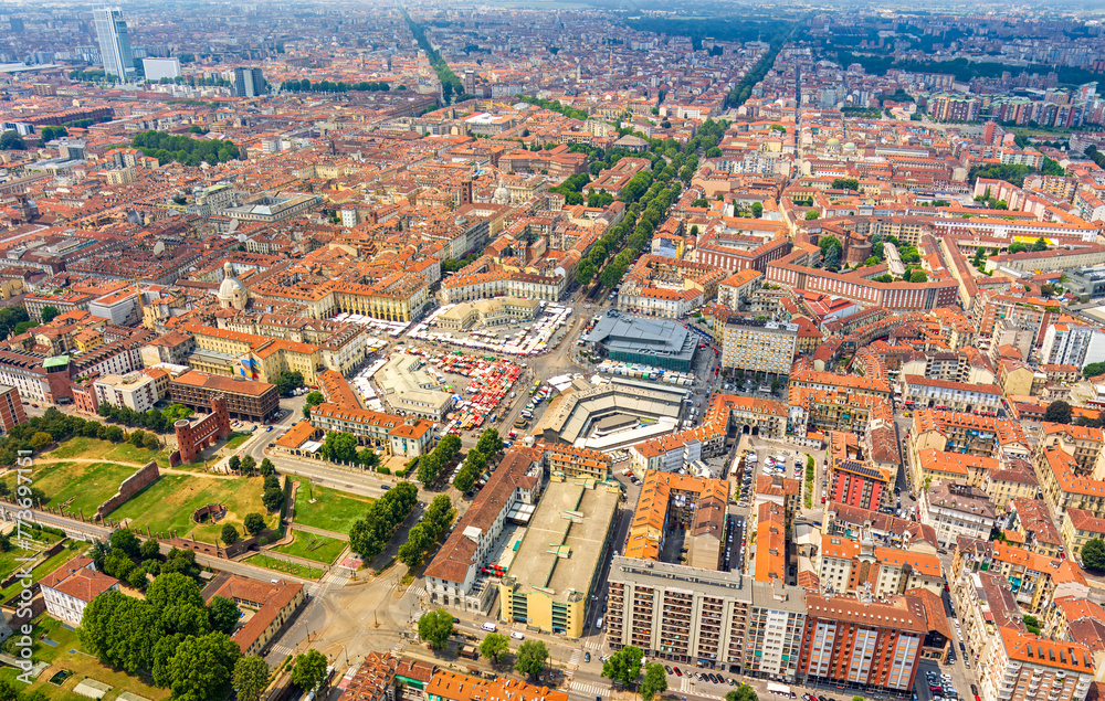 Turin, Italy. Porta Palazzo - Indoor and outdoor markets with a variety of goods. Panorama of the central part of the city. Aerial view