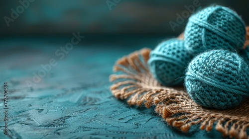  A group of yarn balls resting atop a cloth doily
