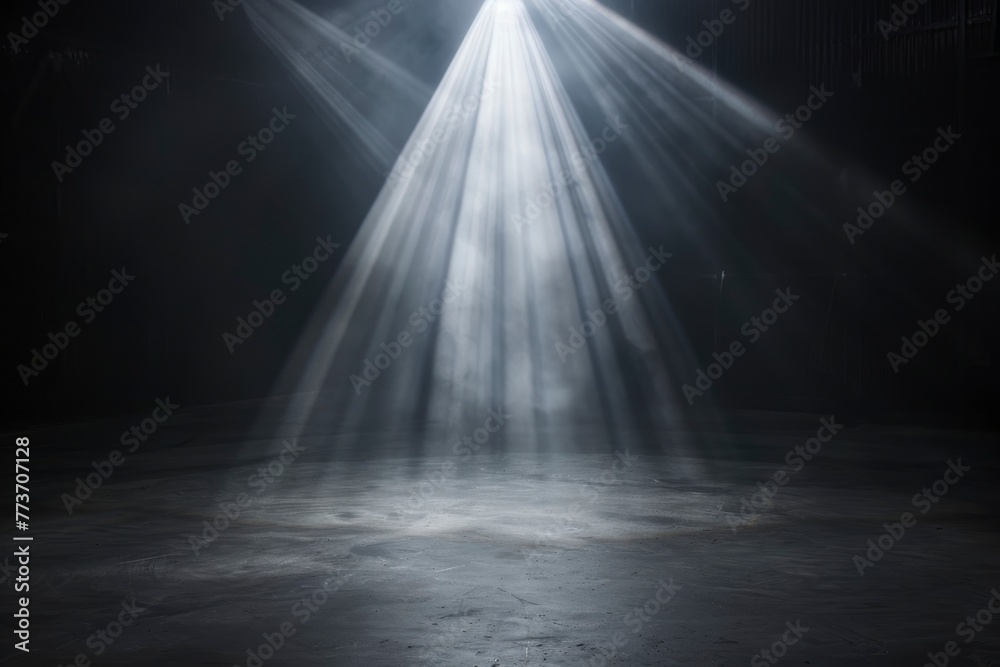 Obraz premium A dark room with a spotlight shining on a floor