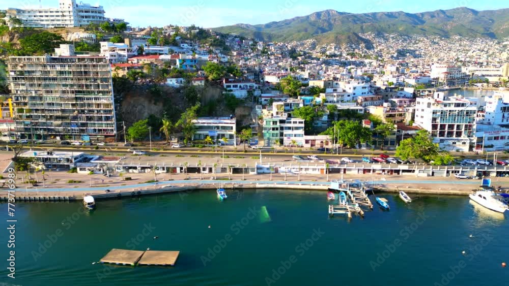Lateral Panoramic Drone Shot of Acapulco's Seashore over fisherman's walk Lateral Panoramic Drone Shot of Acapulco's Seashore over fisherman's walk