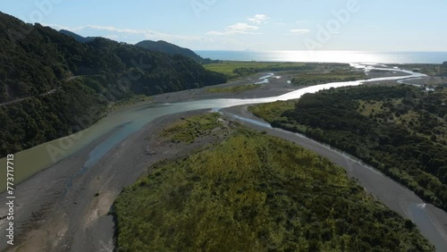 Winding river come deep from hills. Raukokore River, Raukokore, Bay of Plenty, New Zealand. photo