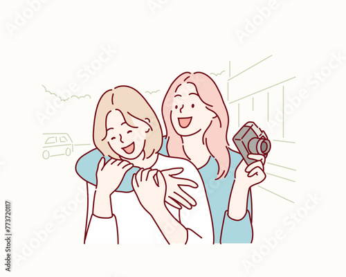 two beautiful young women having fun in the city. Hand drawn style vector design illustrations.