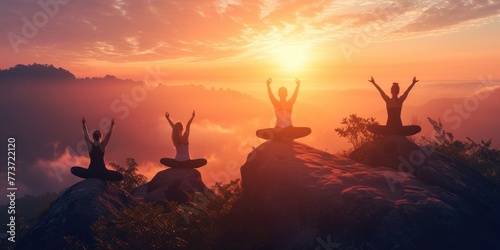 Group of people practicing yoga poses at sunrise on a mountain peak above the clouds  symbolizing peace and mindfulness. Resplendent.