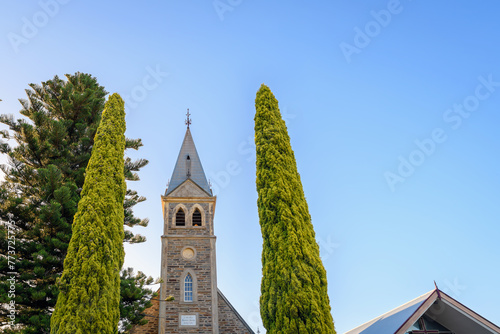 Langmeil Lutheran Church with the long pathway between pencil pines in Tanunda during sunset, Barossa Valley, South Australia