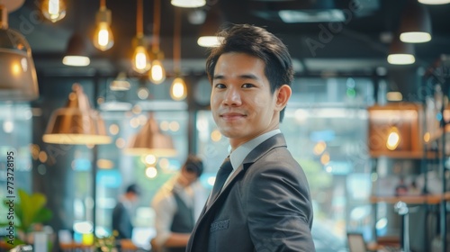 Portrait of Happy Businessman Smiling and Looking at the Camera in Modern Office, Auccessful Asian Male CEO, Manager, Entrepreneur photo