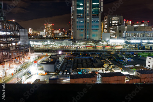 Aerial view of cityscape with construction site and Takanawa Gateway Station at City of Tokyo on a winter night. Photo taken February 16th, 2024, Takanawa, Minato City, Tokyo, Japan. photo