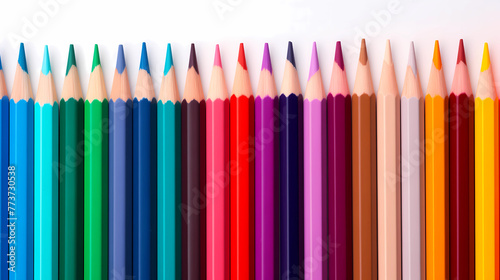 Close up photo of Pencils rolls in a row. Colour pencils isolated on white background. Stationery set. art supply.
