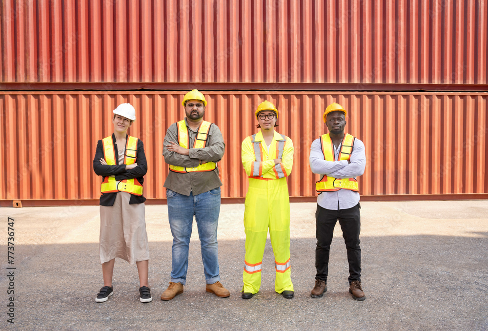 Obraz premium group of diverse container yard workers standing with arms crossed in front of shipping container yard,concept of success of work,pride in work,container in export and import business and logistics