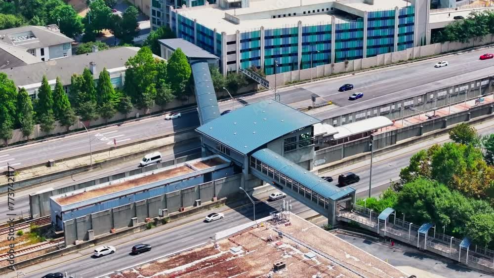 Buckhead Station Pedestrian Bridge Over The Highway In Atlanta, Georgia. - wide shot Buckhead Station Pedestrian Bridge Over The Highway In Atlanta, Georgia. - wide shot