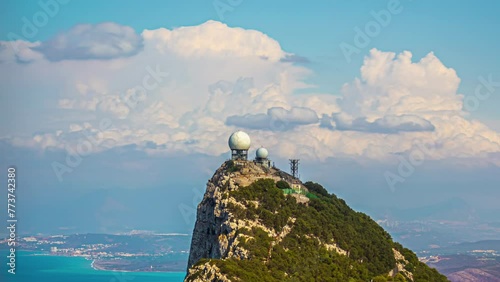 Rock of Gibraltar timelapse, sunny day in British overseas, clouds above radar station