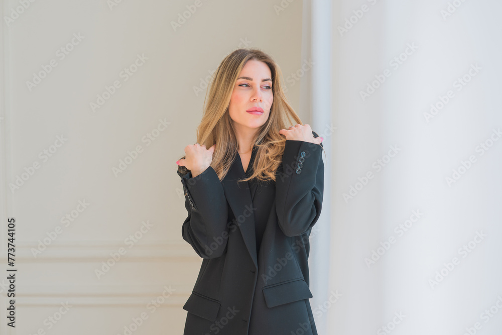 Business woman in black oversize jacket, fashionable outfit for work. Concept of modern lady lifestyle Business woman in black oversize jacket, fashionable outfit for work. Concept of modern lady lifestyle