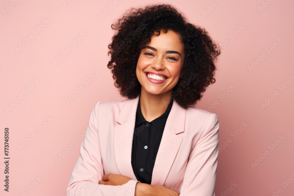 Businesswoman in her early 30s, against a soft peach background, smiling brightly and showing a thumbs-up gesture Businesswoman in her early 30s, against a soft peach background, smiling brightly and showing a thumbs-up gesture
