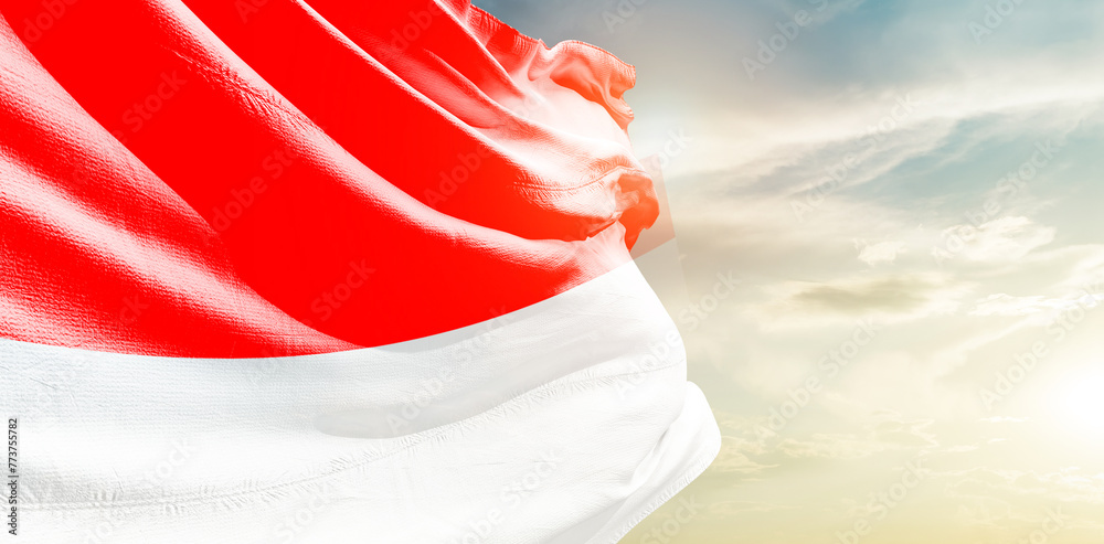 Indonesia national flag waving in the sky. - obrazy, fototapety, plakaty 