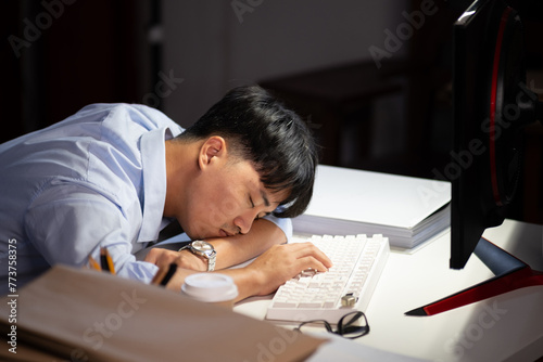 Businessman working overtime at his office He felt tired.