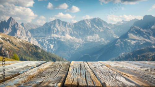 Weathered wooden planks with a vibrant mountain landscape, suitable for background display