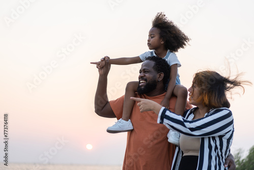 Wallpaper Mural Portrait of enjoy happy love black family.play, having fun, daughter, parenthood, care, superhero.african american father and mother with little african girl child smiling moments good time at home Torontodigital.ca