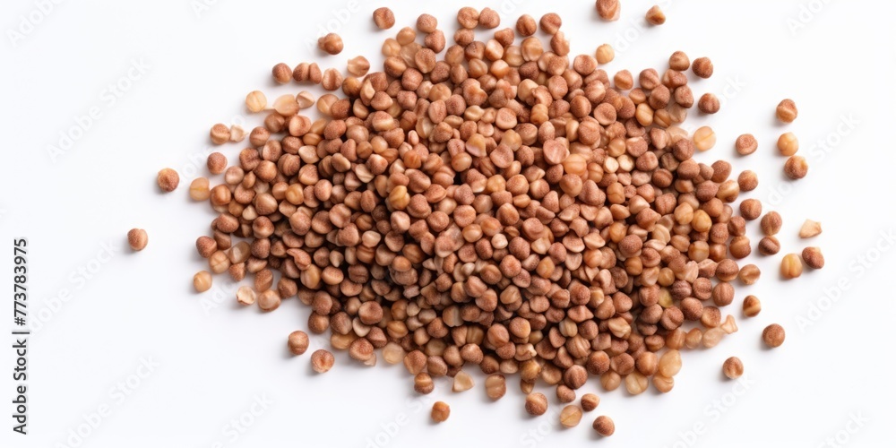 A pile of brown seeds on a white background A pile of brown seeds on a white background