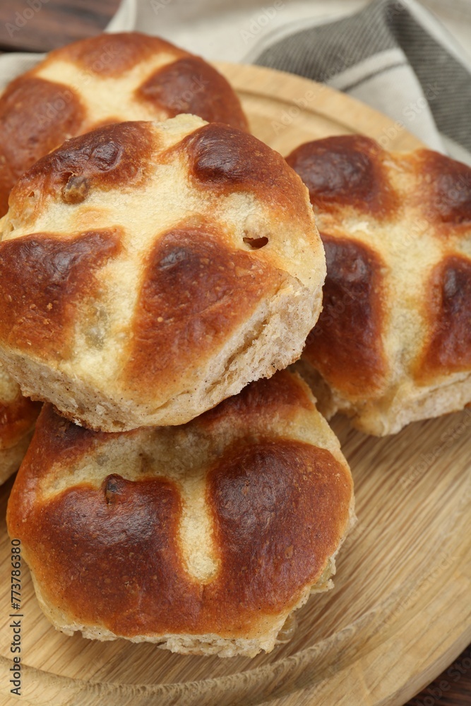 Tasty hot cross buns on table, closeup Tasty hot cross buns on table, closeup