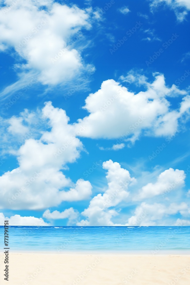 Beautiful beach and tropical sea under the blue sky with white clouds