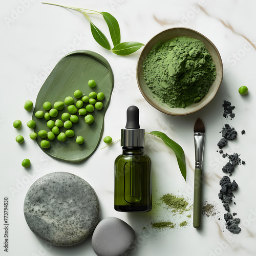 flat lay of luxury green serum bottle placed aroung clay, green tea and peas in a spa setting with dramatic lighting againat white photo