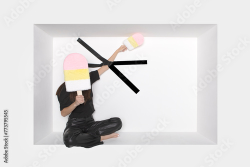 Girl with ice cream candy and black adhesive tape stuck on hand photo