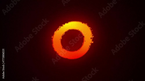 solar eclipse effect with a glowing orange halo on a dark background animation, 4k