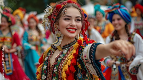 Smiling woman in traditional festive costume dancing at a cultural celebration