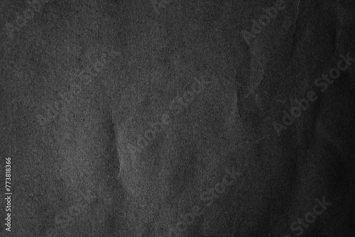 Blank Recycled creased wrap black color paper texture background photo