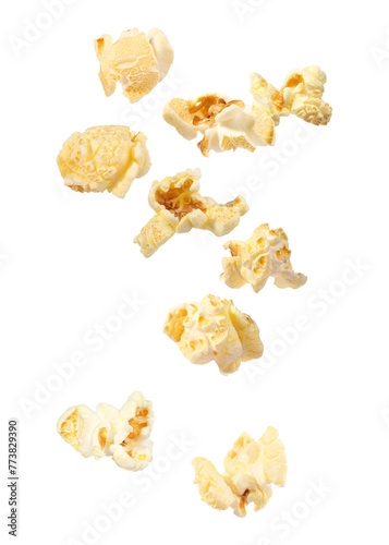 Tasty fresh popcorn flying on white background