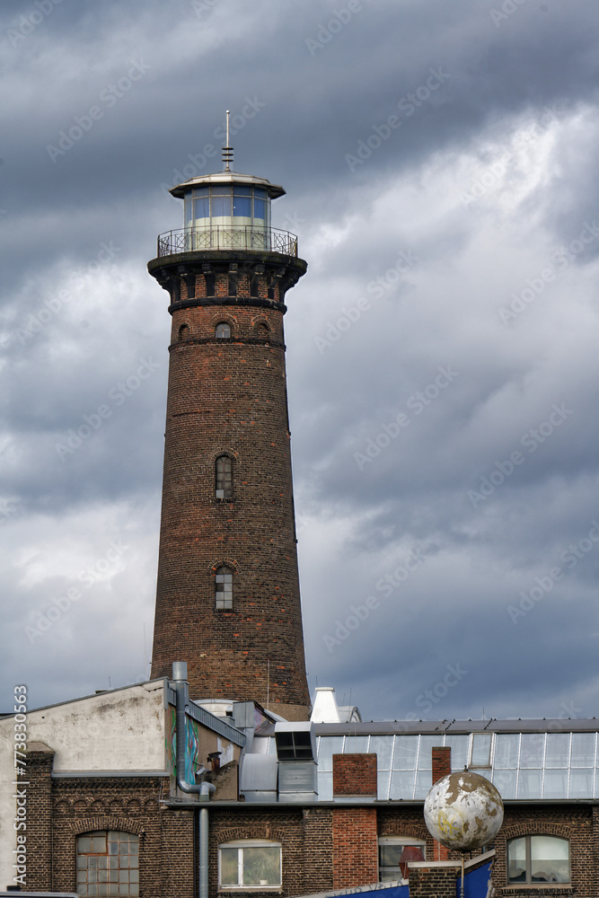 the helios inland lighthouse in cologne ehrenfeld against a gloomy cloudy sky