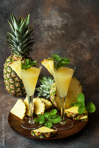 Pineapple cocktail or juice in two glasses