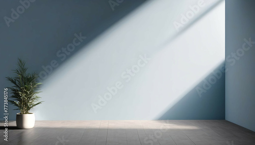Beautiful gray-blue empty wall with lateral lighting and interesting chiaroscuro. Minimalistic background for product presentation.