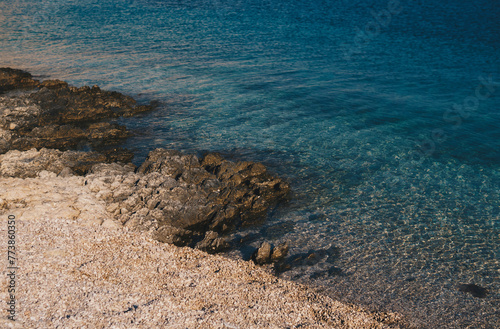 Detail of coast of Mediterranean Sea on pebble beach