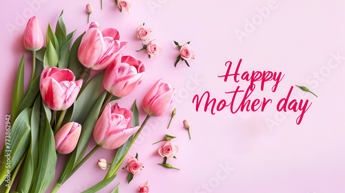 Happy Mother's Day. Beautiful ranunculus flowers on light pink background, flat lay