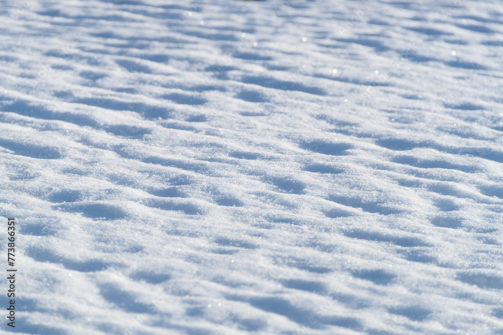Snow texture. Background of pure blue and white snow. Winter pattern. Snow texture. Background of pure blue and white snow. Winter pattern.