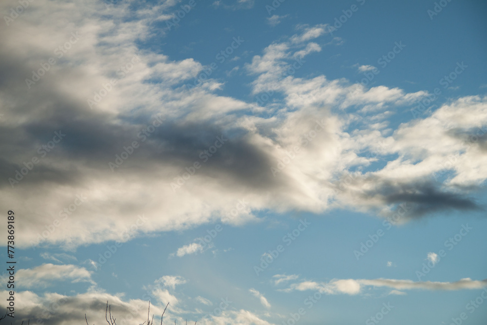 Clouds in the blue sky on a sunny day. Sunny sky background Clouds in the blue sky on a sunny day. Sunny sky background