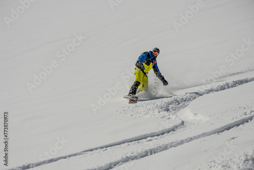 Ski, Snowboard freeride i deep powder snow. Gudauri Georgia Caucasus resort. Freeride in Caucasus mountains. Freeride snowboarding in winter. Heliboarding freeride. Riding in powder on snowborad.