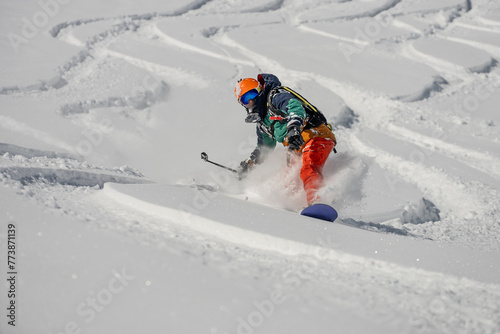 Ski, Snowboard freeride i deep powder snow. Gudauri Georgia Caucasus resort. Freeride in Caucasus mountains. Freeride snowboarding in winter. Heliboarding freeride. Riding in powder on snowborad.